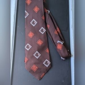 Vintage 1960s or 70s brown with design orange wide polyester tie by Schiaparelli